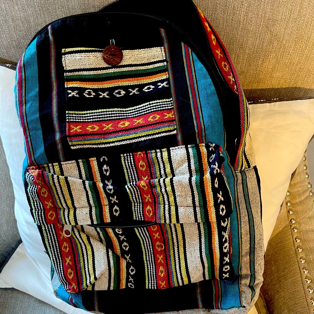 Brand new without tags Rising International multi-colored backpack./bag